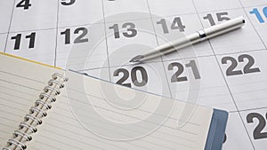 notebook and pen on the calendar