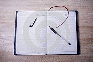 Notebook and a pen photo