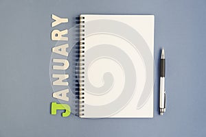 Notebook with pen and January text