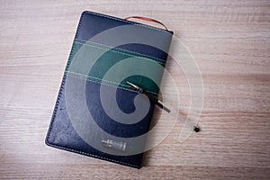 Notebook and a pen photo