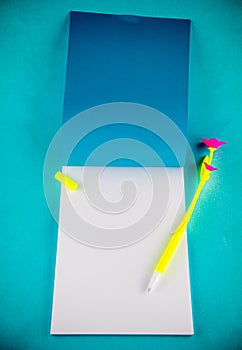 Notebook with pen, open