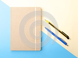 Notebook, pen, pencil and other supplies for business office. Copy space. Top view.