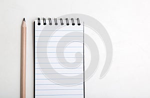 Notebook and pencil
