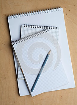 Notebook with pencile on a wooden