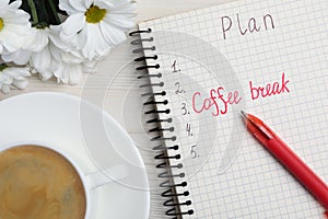Notebook with phrase Coffee Break among plan items, cup of drink and flowers on white wooden table, flat lay