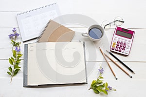 Notebook planner ,calendar ,calculator and mobile phone for business work