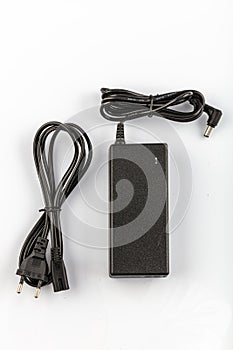 Notebook power AC / DC adapter isolated on white background