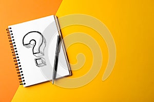 Notebook with question mark and pen on background, top view. Space for text