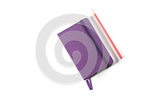 Notebook and red pencil