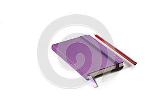 Notebook and red pencil