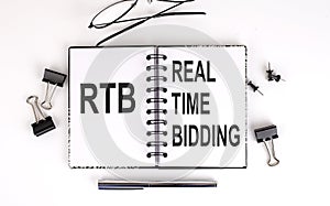 Notebook with RTB - Real-time bidding on table with office tools