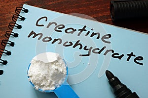 Notebook with sign Creatine monohydrate. photo