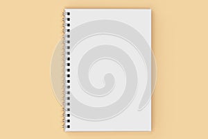 notebook spiral bound on orange background