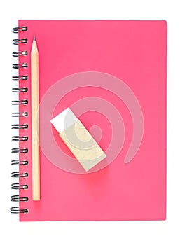 Notebook spiral bound and pencil on white background