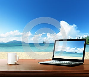 notebook on table and beach