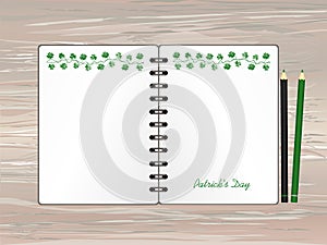 Notebook with template hand-drawn Green festive bunting with clover and pencil. Irish holiday - Happy St. Patrick`s Day with a