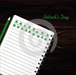 Notebook with template hand-drawn Green festive bunting with clover and pencil. Irish holiday - Happy St. Patrick`s Day with a