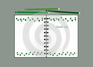 Notebook with template hand-drawn Green festive bunting with clover and pencil. Irish holiday - Happy St. Patrick`s Day with a