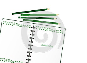 Notebook with template hand-drawn Green festive bunting with clover and pencil. Irish holiday - Happy St. Patrick`s Day with a