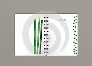 Notebook with template hand-drawn Green festive bunting with clover and pencil. Irish holiday - Happy St. Patrick`s Day with a