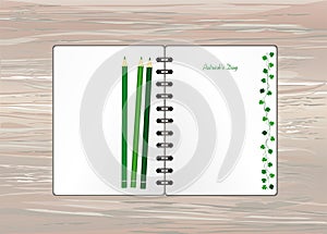 Notebook with template hand-drawn Green festive bunting with clover and pencil. Irish holiday - Happy St. Patrick`s Day with a