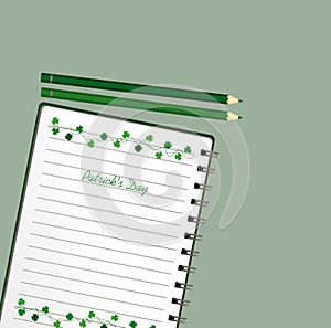 Notebook with template hand-drawn Green festive bunting with clover and pencil. Irish holiday - Happy St. Patrick`s Day with a