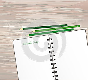 Notebook with template hand-drawn Green festive bunting with clover and pencil. Irish holiday - Happy St. Patrick`s Day with a