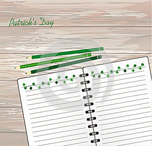 Notebook with template hand-drawn Green festive bunting with clover and pencil. Irish holiday - Happy St. Patrick`s Day with a