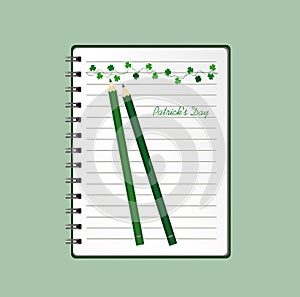 Notebook with template hand-drawn Green festive bunting with clover and pencil. Irish holiday - Happy St. Patrick`s Day