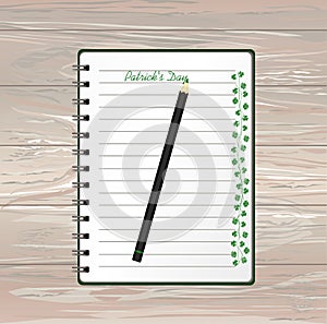 Notebook with template hand-drawn Green festive bunting with clover and pencil. Irish holiday - Happy St. Patrick`s Day