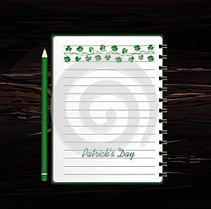 Notebook with template hand-drawn Green festive bunting with clover and pencil. Irish holiday - Happy St. Patrick`s Day