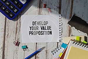 notebook with text Develop Your Value Proposition