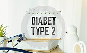 In the notebook text DIABETES TYPE 2, next to a lot of tablets