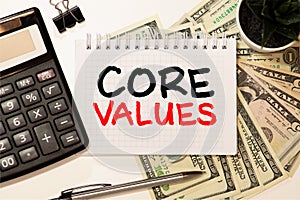 Notebook with text inside Core Values on table