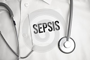 Notebook with text SEPSIS with pen and stethoscope, medicina photo
