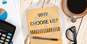Notebook with text - Why Choose Us near office supplies