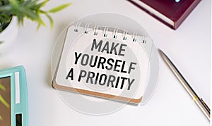 Notebook with text written - Make Yourself a Priority