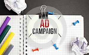 Notebook with Toolls and Notes about Ad Campaign