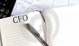 Notebook with Toolls and Notes about CFO