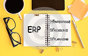 Notebook with Toolls and Notes about ERP, concept