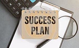 Notebook with Toolls and Notes about Success Plan