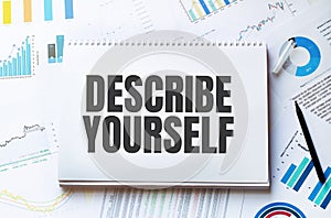 Notebook with Tools and Notes with text DESCRIBE YOURSELF