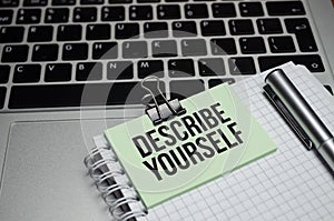 Notebook with Tools and Notes with text DESCRIBE YOURSELF