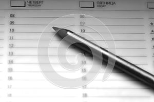 Notebook  with a weekly action plan and pencil