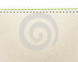 Notebook with wire close up. Refurbish brown paper