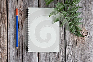 A notebook on wood background