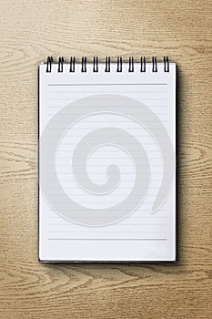 Notebook on wood background