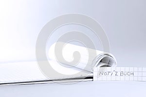 Notebook word in German is Notizbuch