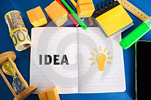 Notebook with word Idea and light bulb idea icon. Concept of new innovation ideas and discoveries. Vision, planning. Strategy and