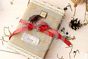 Notebook for writing dreams and memories decorated with bright red ribbon and cute dry rose. Romantic concept